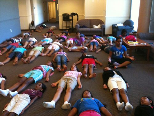09_sv-camp Savasana or the corpse pose if the favorite among the kids as you can image at this time in the morning.