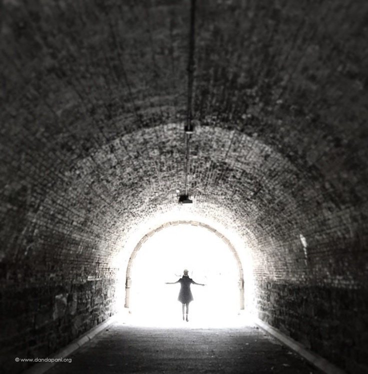 My wife walking into the tunnel of light. Central Park, New York City.