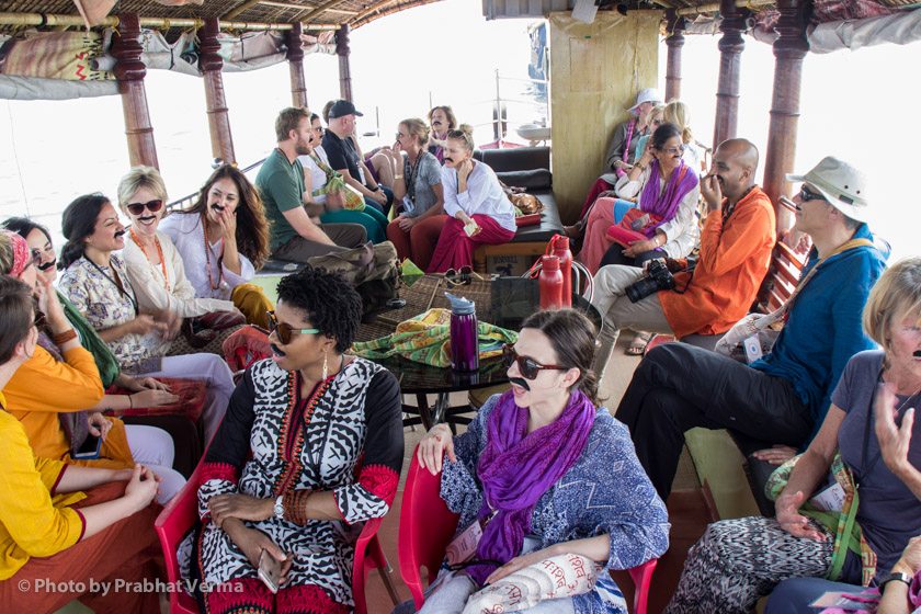 Two boats full of mustache wearing spiritual seekers sail off to lunch