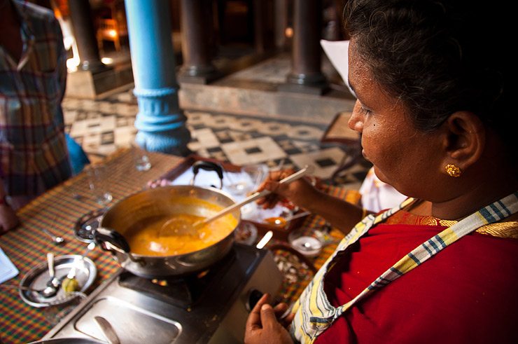 Dumplings are placed gently into the curry (sauce)