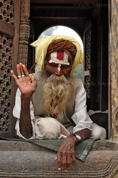 A 106-year-old Hindu sadhu (wandering monk) rests in the confines of a shrine at the sacred Pasupathinath temple grounds. Kathmandu, Nepal.