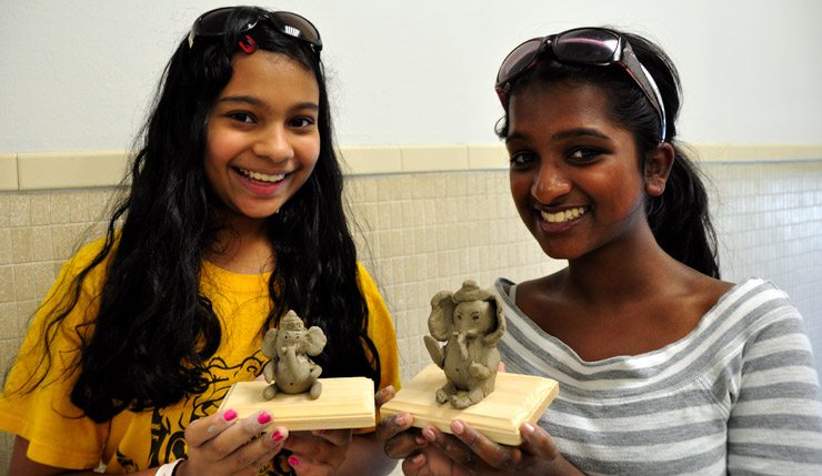 Making clay Ganeshas